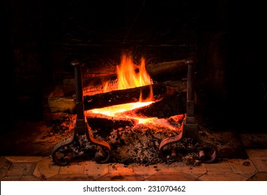 Fire In Antique Fireplace In Old Castle. Closeup.