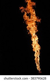 Fire artist performing extreme fire breathing 