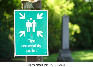 Fire Assembly Point Sign At Workplace Signpost