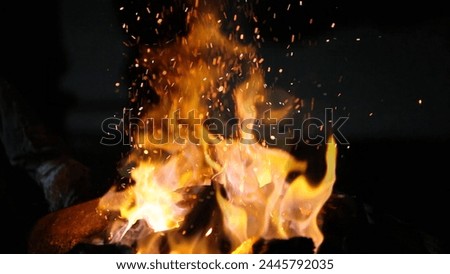 Fire in the blacksmith's forge, close-up of hands