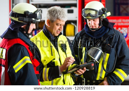 Fire brigade - Squad leader gives instructions, he used the Tablet Computer to plan the deployment