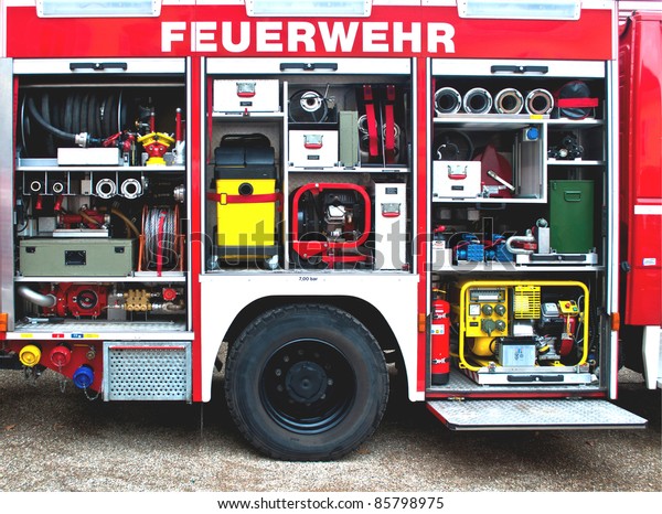 Fire brigade\
truck with open doors and\
equipment