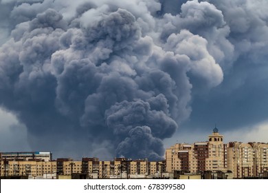 A fire in the building. A large smoke cloud from the fire.