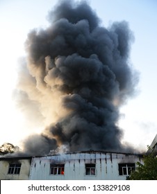 Fire Burning And Black Smoke Over The House.