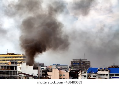 Fire Burning And Black Smoke Over The Commercial Building.