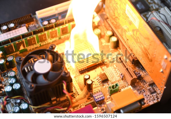 \
Fire\
Burning ,blazing computer motherboard, cpu,gpu and video card,\
processor on circuit board with\
electronic\
