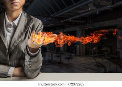 Fire burning in her hands. Mixed media