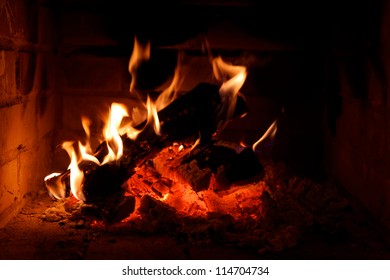 A Fire Burning In An Open Fire Place