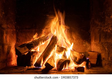 A fire burns in a fireplace, Fire to keep warm. Winter time - Powered by Shutterstock