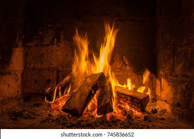 A Fire Burns In A Fireplace, Fire To Keep Warm.