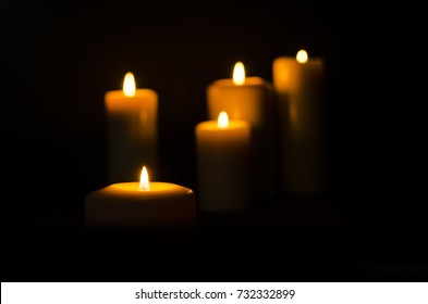 Fire Candle On Dark Black Background