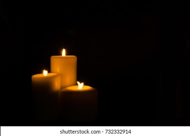 Fire Candle On Dark Black Background