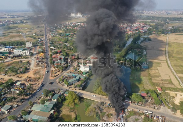 A fire at a car\
parking lot in Te Lo commune, Yen Lac district, Vinh Phuc province\
on a dry, sunny afternoon.