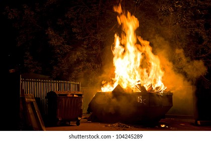 Fire In The City Night: Burning Trash Container