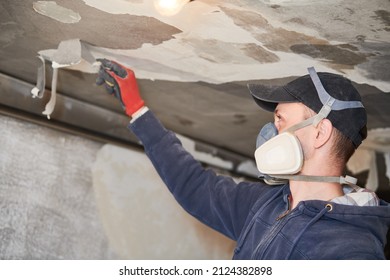 fire damage and restoration indoor interior. removing damaged paint layer - Shutterstock ID 2124382898