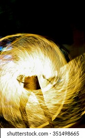 Fire dancer performance at night.