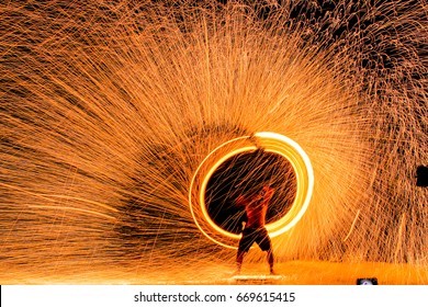 Fire dancers Swing fire dancing show fire show on the beach dance man juggling with fire , Koh Samet, Thailand - Shutterstock ID 669615415