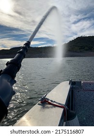 Fire Department Boat With Deck Cannon Spraying Water