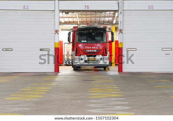 Fire\
Department. Israeli fire truck with text. Fire engine car. Nobody\
in the vehicle. 17 September 2019. Tel Aviv.\
Israel