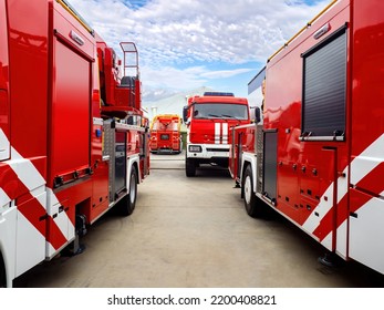 Fire Department Vehicle. Parking Lot With Fire Trucks. Automotive Portal Of Emergency Service. Specialized Firefighting Vehicles In Open Air. Parking Lot For Firefighters. Fire Fighting Vehicle