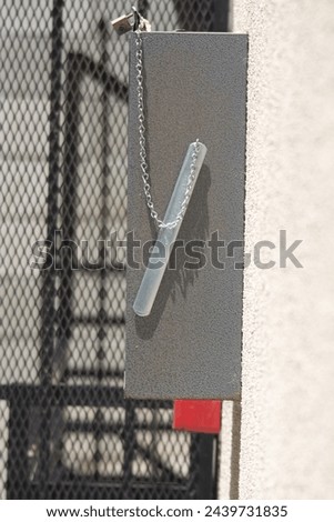 Fire distinguisher box on a wall outside a building
