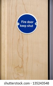 Fire Door Keep Shut Sign On An Office Door