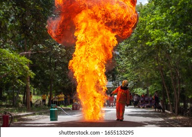 Fire Drill Training In The School. Firemen Work Closely Flame Firefighter Have To Wearing Fire Suit For Safety.