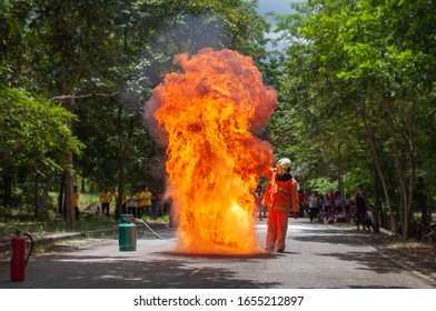 Fire Drill Training In The School. Firemen Work Closely Flame Firefighter Have To Wearing Fire Suit For Safety.