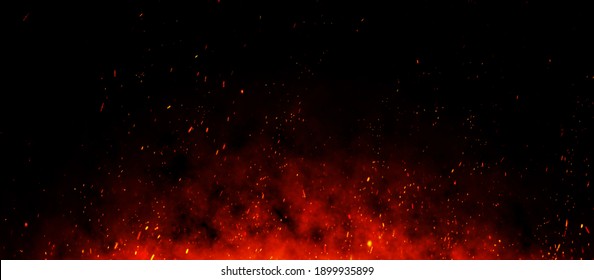Fire embers particles over black background. Fire sparks background. Abstract dark glitter fire particles lights. bonfire in motion blur. - Shutterstock ID 1899935899