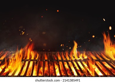 Fire embers particles over black background.  Grill Background - Empty Fired Barbecue On Black . Abstract dark glitter fire particles lights.  - Shutterstock ID 2141385491