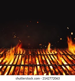 Fire embers particles over black background.  Grill Background - Empty Fired Barbecue On Black . Abstract dark glitter fire particles lights.  - Shutterstock ID 2142772063