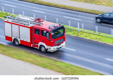 Fire engine driving down street