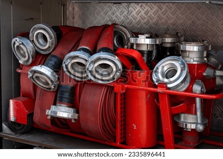 Fire engine equipment from the inside - fire hose hoses ready for use close uo