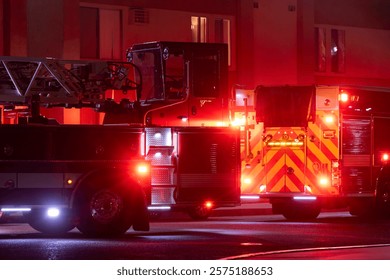 A fire engine responds to the scene of an emergency at night.