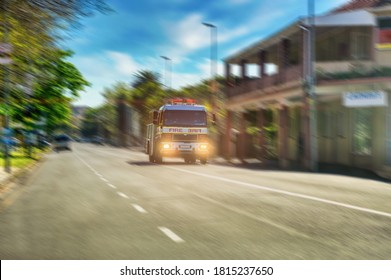 fire engine with sirens on going fast on the street