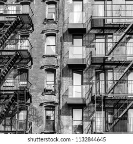 A fire escape of an apartment building in New York city. Graphical black and white image. - Powered by Shutterstock