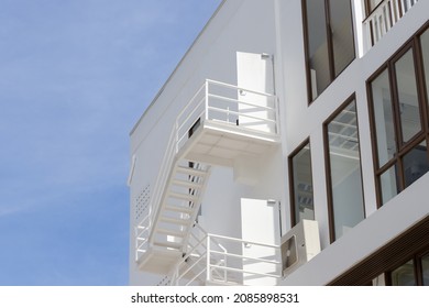 fire escape stair steel. white outdoor metal stair of building.