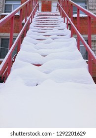 Fire Escape In Winter. The Snow On The Stairs. Fire Safety