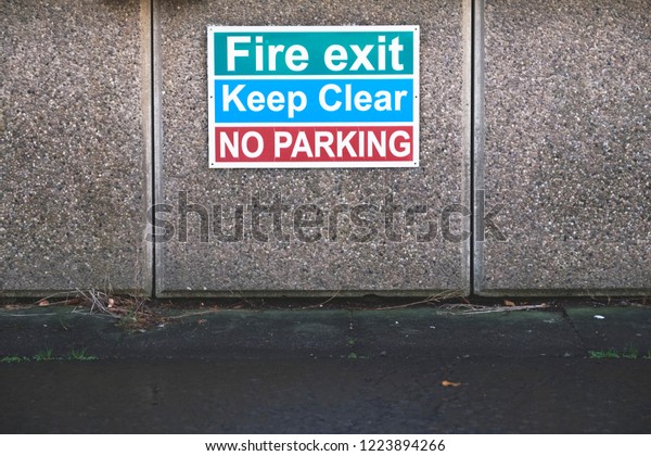 Fire exit keep clear no\
parking sign