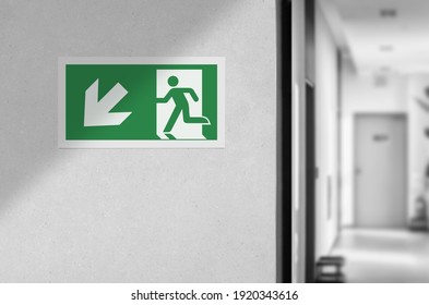 Fire exit sign in the corridor of the building