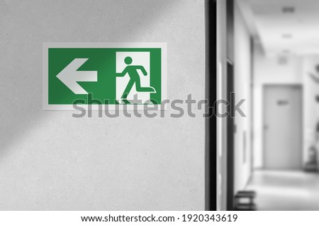 Fire exit sign in the corridor of the building