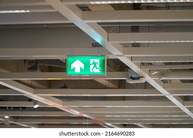 Fire Exit Sign In Factory,Fire Exit Signs Indicate A Safe Emergency Exit Route.

