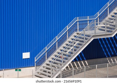 fire exit stair of large factory building. galvanise metal stair step. - Shutterstock ID 2165691091