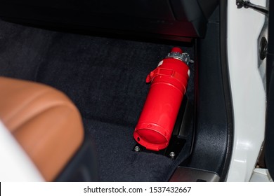 Fire Extinguisher In Car On Black