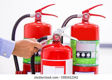 Fire Extinguisher, Firefighter Use Inspection List Checking Pressure Gauge Level Of Fire Extinguisher Tank In The Building Of Protection And Prevent For Emergency And Safety Rescue And Fire Training.