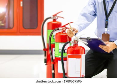 Fire Extinguisher, Firefighter Use Inspection List Checking Pressure Gauge Level Of Fire Extinguisher Tank In The Building Of Protection And Prevent For Emergency And Safety Rescue And Fire Training.