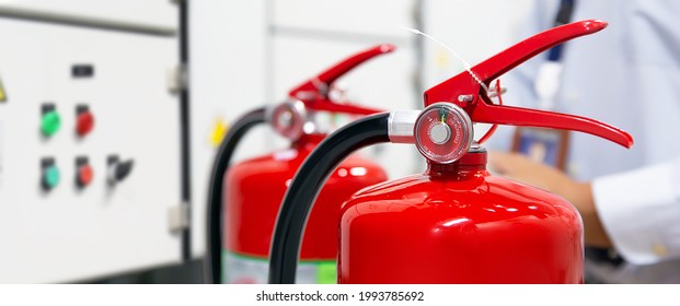 Fire Extinguisher, Firefighter Use Inspection List Checking Pressure Gauge Level Of Fire Extinguisher Tank In The Building Of Protection And Prevent For Emergency And Safety Rescue And Fire Training.