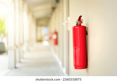 Fire extinguisher in the operating department. Fire system hanging on the wall in the hotel.