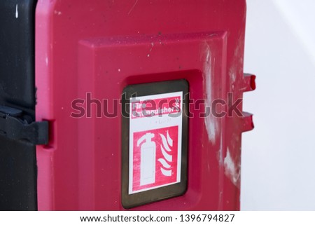 Fire extinguisher red box casing on ferry ship