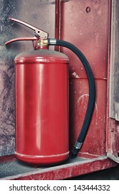 Fire Extinguisher In Red Cabinet On Wall.